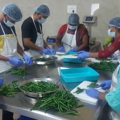 staff cleaning vegetables